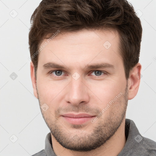 Neutral white young-adult male with short  brown hair and grey eyes