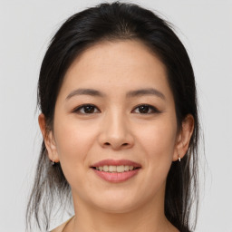 Joyful asian young-adult female with medium  brown hair and brown eyes