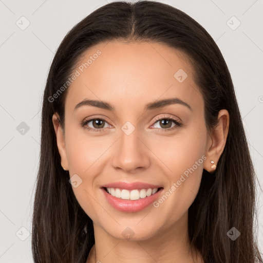 Joyful white young-adult female with long  brown hair and brown eyes