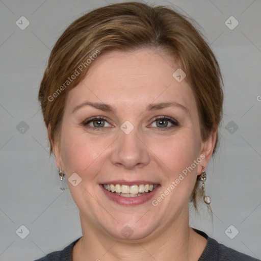 Joyful white adult female with medium  brown hair and grey eyes