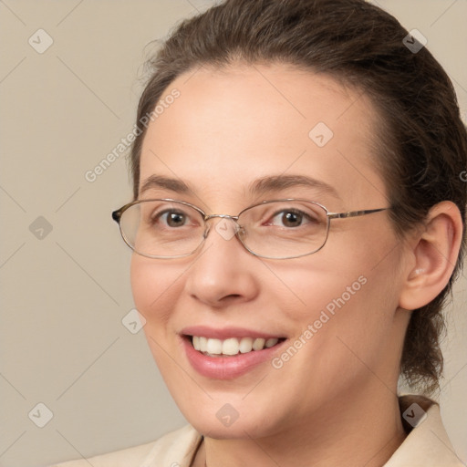 Joyful white adult female with medium  brown hair and brown eyes