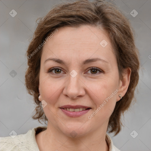 Joyful white adult female with medium  brown hair and grey eyes