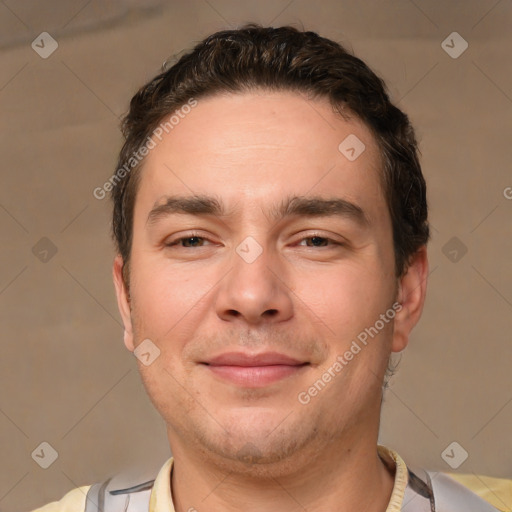 Joyful white adult male with short  brown hair and brown eyes