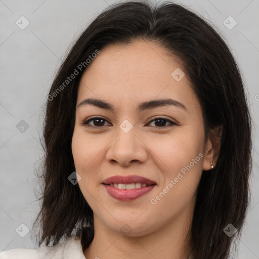 Joyful asian young-adult female with long  brown hair and brown eyes