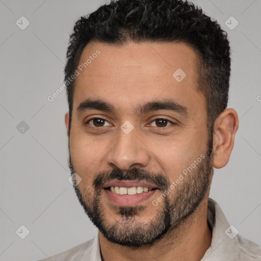 Joyful white young-adult male with short  black hair and brown eyes