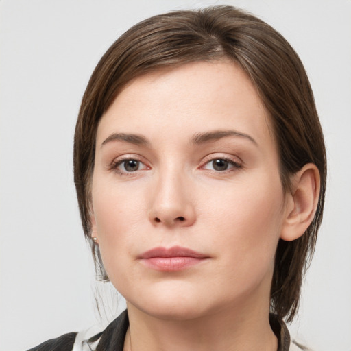 Neutral white young-adult female with medium  brown hair and grey eyes