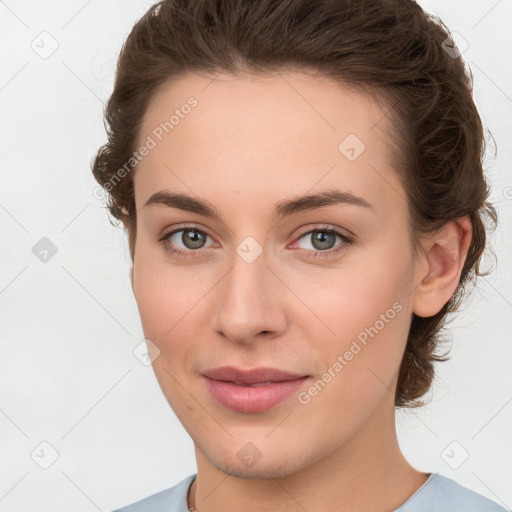 Joyful white young-adult female with medium  brown hair and green eyes