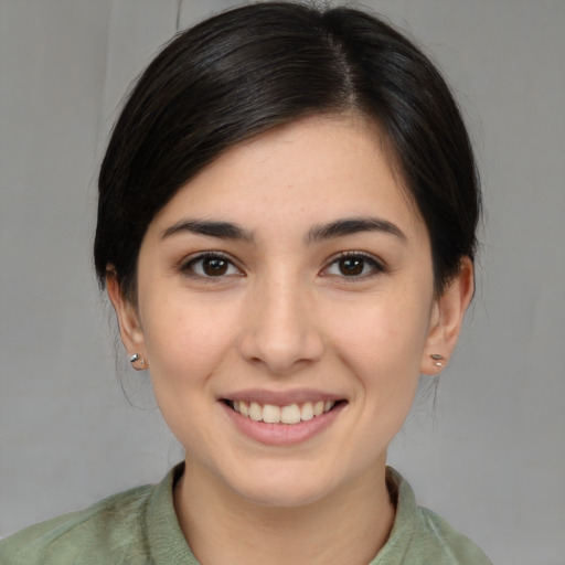 Joyful white young-adult female with medium  brown hair and brown eyes