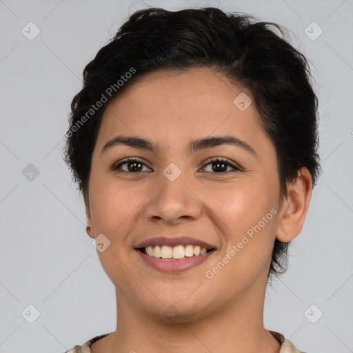 Joyful latino young-adult female with short  brown hair and brown eyes