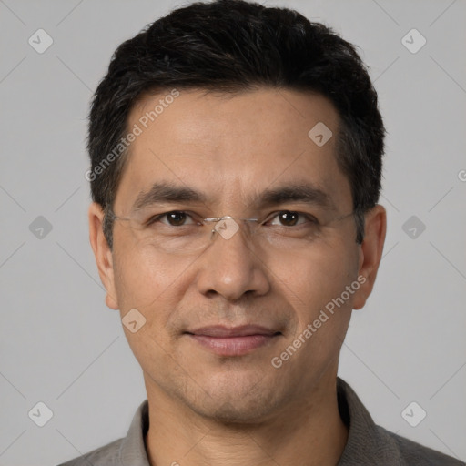 Joyful white adult male with short  black hair and brown eyes