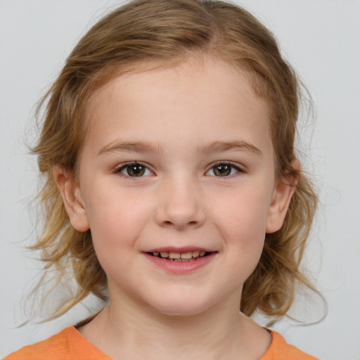 Joyful white child female with medium  brown hair and brown eyes