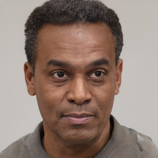 Neutral latino adult male with short  brown hair and brown eyes