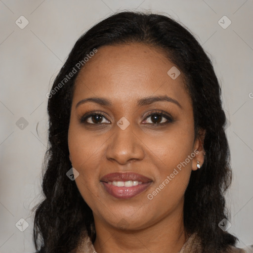 Joyful black young-adult female with long  black hair and brown eyes