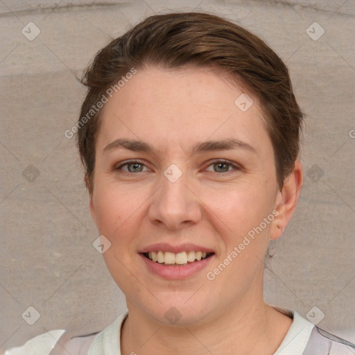 Joyful white young-adult female with short  brown hair and grey eyes