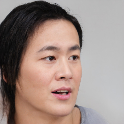 Neutral asian young-adult male with medium  brown hair and brown eyes