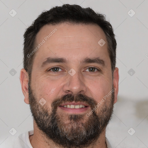 Joyful white adult male with short  brown hair and brown eyes