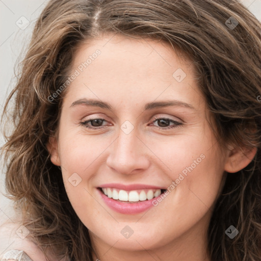 Joyful white young-adult female with long  brown hair and green eyes