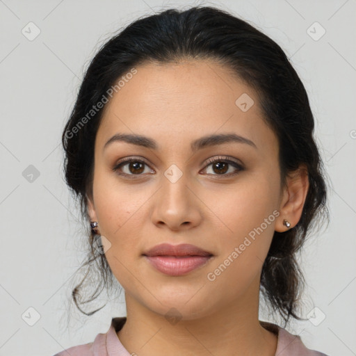 Joyful latino young-adult female with medium  black hair and brown eyes