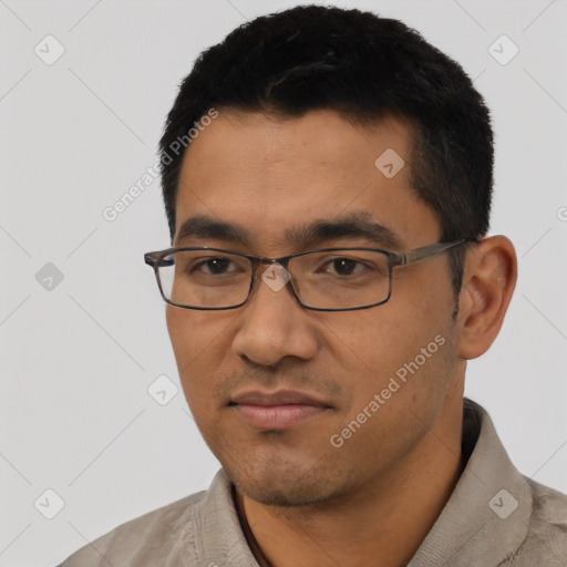 Joyful asian young-adult male with short  black hair and brown eyes