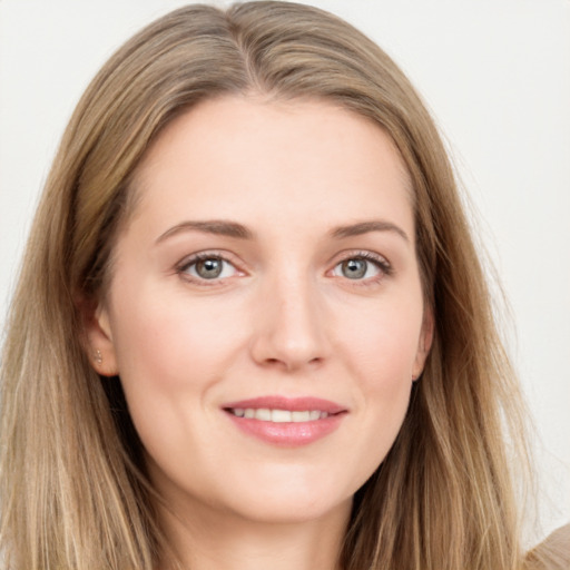 Joyful white young-adult female with long  brown hair and grey eyes