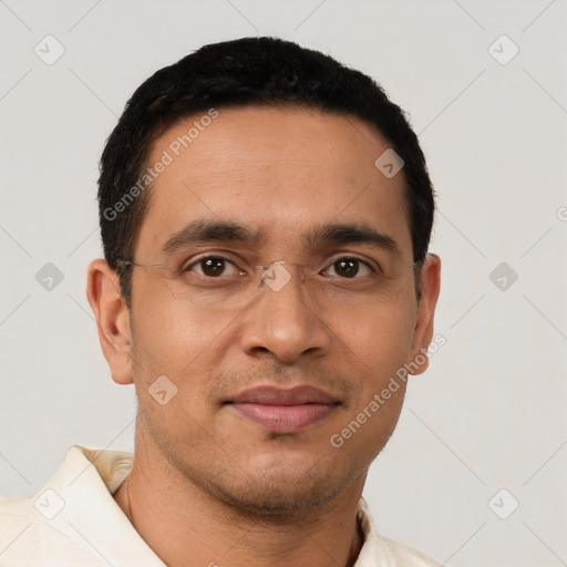 Joyful latino young-adult male with short  brown hair and brown eyes