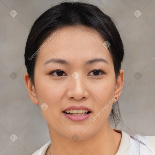 Joyful asian young-adult female with medium  black hair and brown eyes