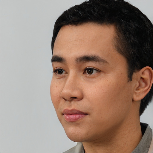 Neutral asian young-adult male with short  black hair and brown eyes
