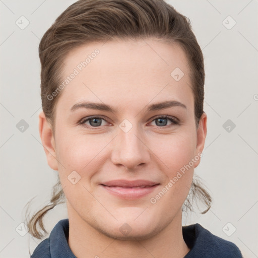 Joyful white young-adult female with short  brown hair and grey eyes