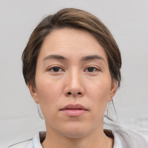 Neutral white young-adult female with medium  brown hair and brown eyes