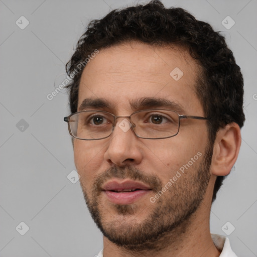 Joyful white adult male with short  brown hair and brown eyes