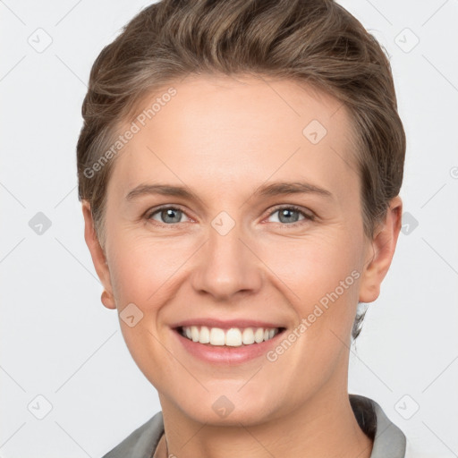 Joyful white young-adult female with short  brown hair and grey eyes