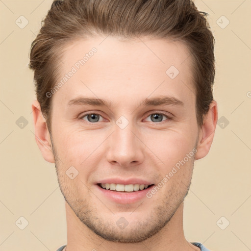 Joyful white young-adult male with short  brown hair and grey eyes