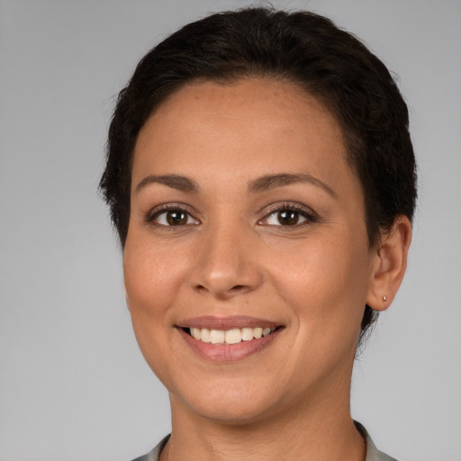 Joyful white young-adult female with short  brown hair and brown eyes