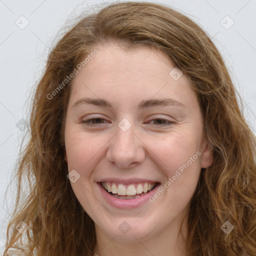 Joyful white young-adult female with long  brown hair and green eyes