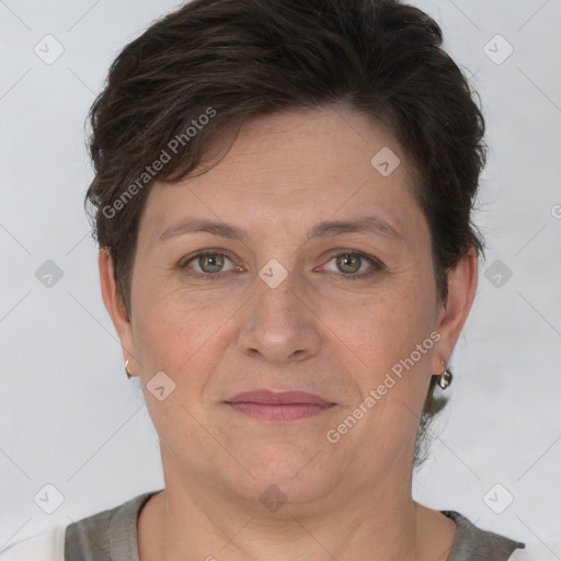 Joyful white adult female with short  brown hair and brown eyes