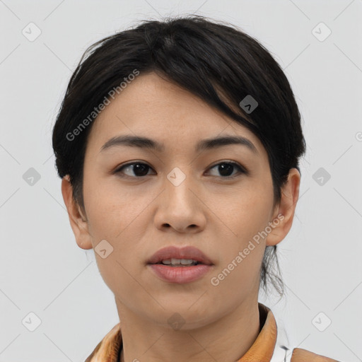 Joyful asian young-adult female with short  black hair and brown eyes