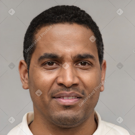 Joyful latino adult male with short  brown hair and brown eyes