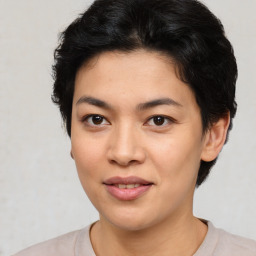 Joyful asian young-adult female with short  black hair and brown eyes