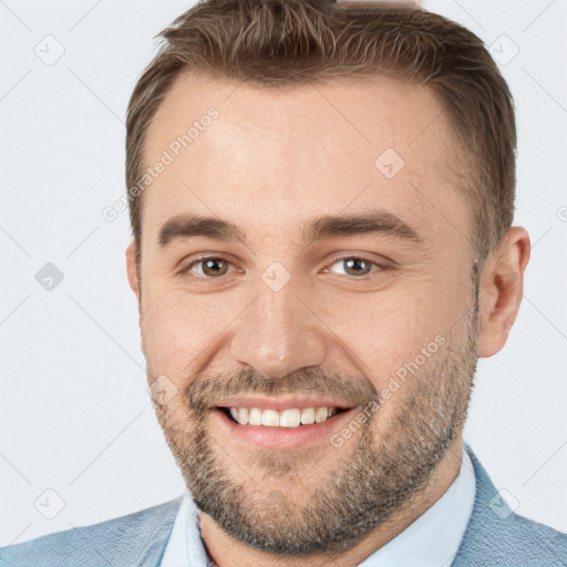 Joyful white adult male with short  brown hair and brown eyes