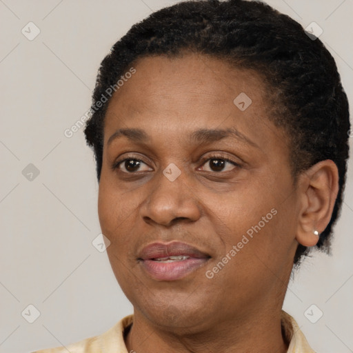 Joyful latino adult female with short  brown hair and brown eyes