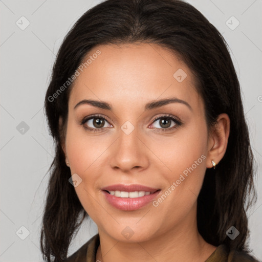 Joyful white young-adult female with long  brown hair and brown eyes