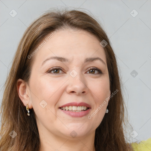 Joyful white adult female with long  brown hair and brown eyes