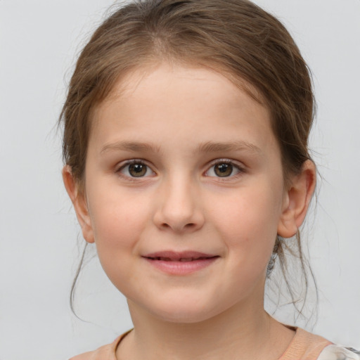 Joyful white child female with medium  brown hair and brown eyes