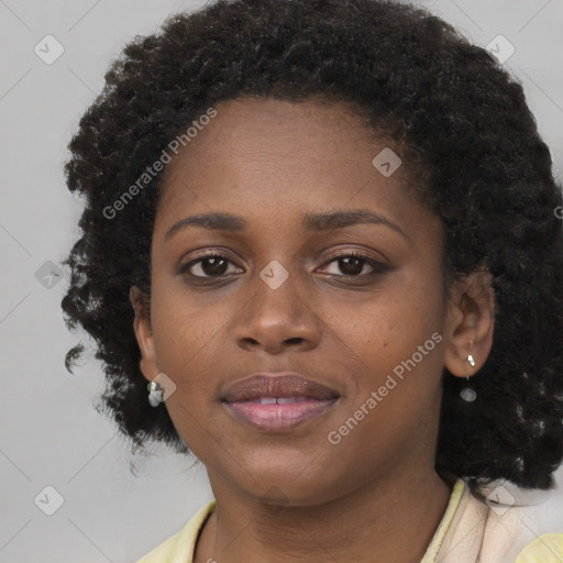 Joyful black young-adult female with medium  brown hair and brown eyes