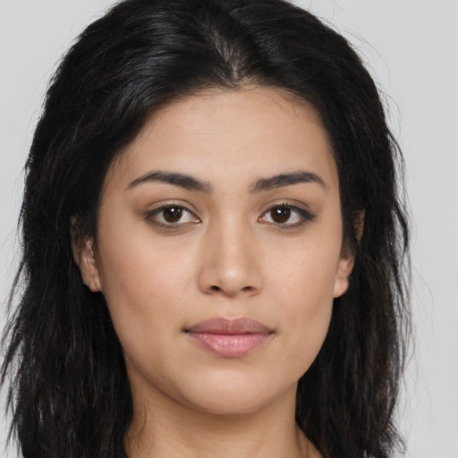 Joyful asian young-adult female with long  brown hair and brown eyes