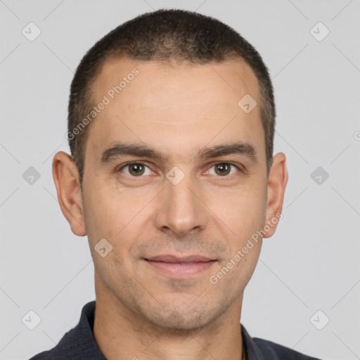 Joyful white adult male with short  black hair and brown eyes