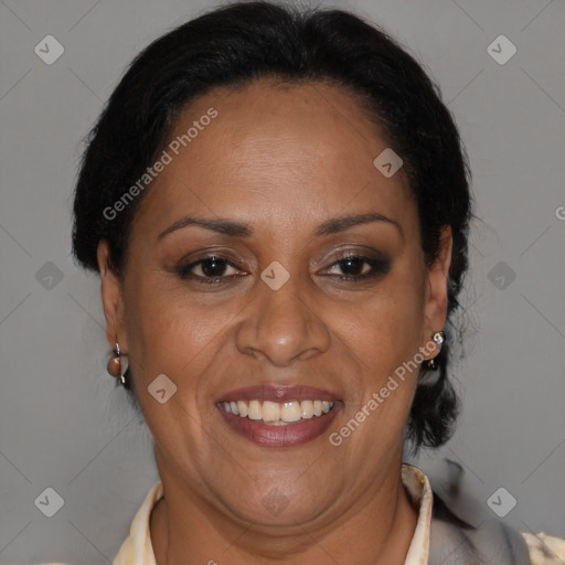 Joyful latino adult female with medium  brown hair and brown eyes