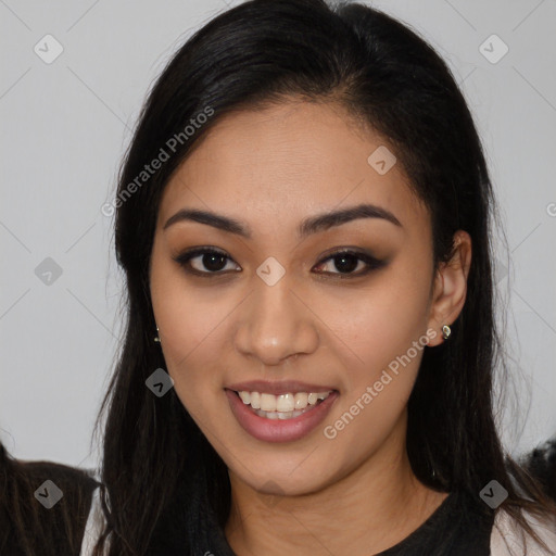 Joyful latino young-adult female with long  brown hair and brown eyes