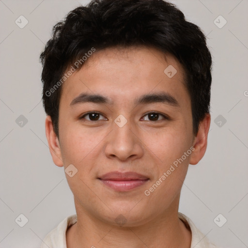 Joyful asian young-adult male with short  brown hair and brown eyes