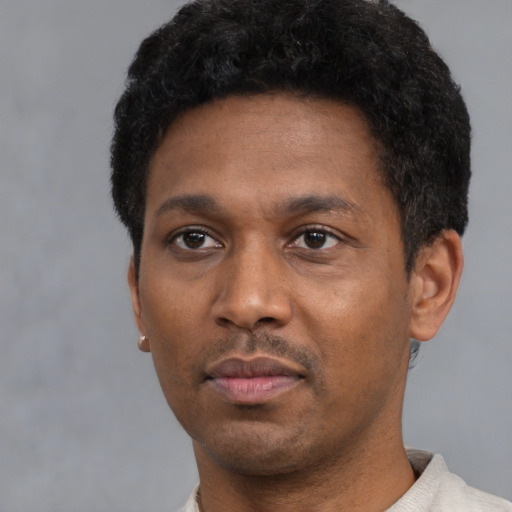 Neutral black young-adult male with short  black hair and brown eyes